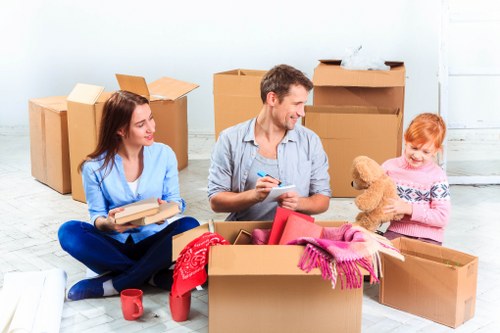 Loading a sofa and wardrobe for furniture pick-up in Ilford